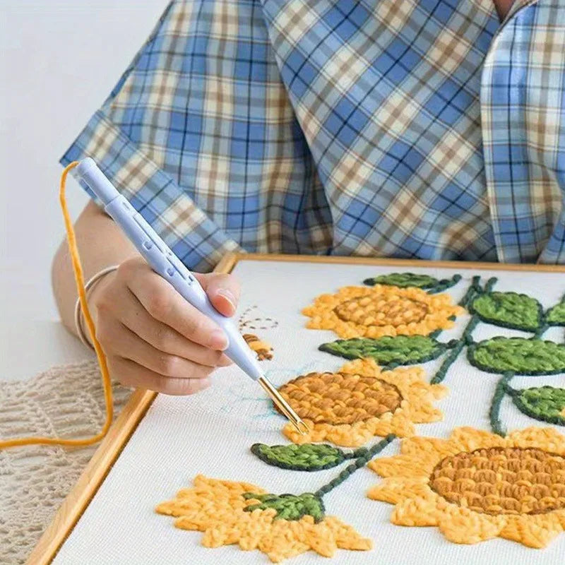 Punch needle in uso: girasoli di filato sulla tela nel telaio