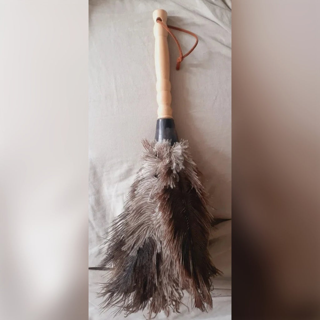 Foto cliente: il piumino su un divano, con manico e laccetto in alto