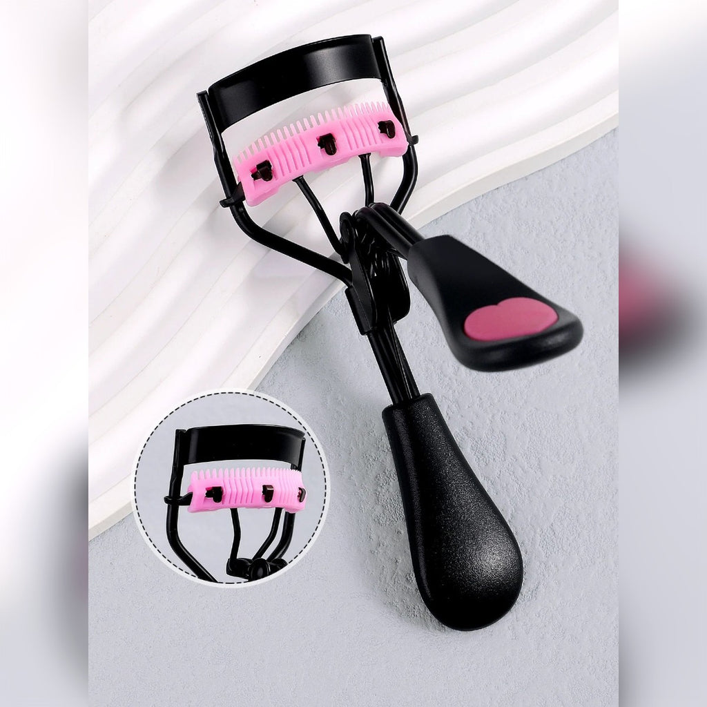 Piegaciglia nero con cuscinetto rosa a pettine e cuore rosa sul manico