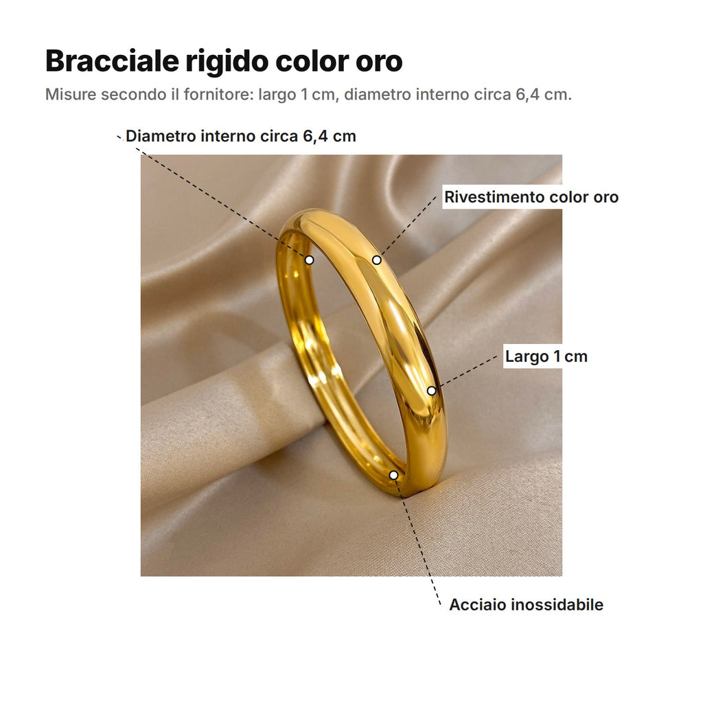 Bracciale rigido color oro spiegato: diametro interno circa 6,4 cm, rivestimento color oro, largo 1 cm, acciaio inossidabile