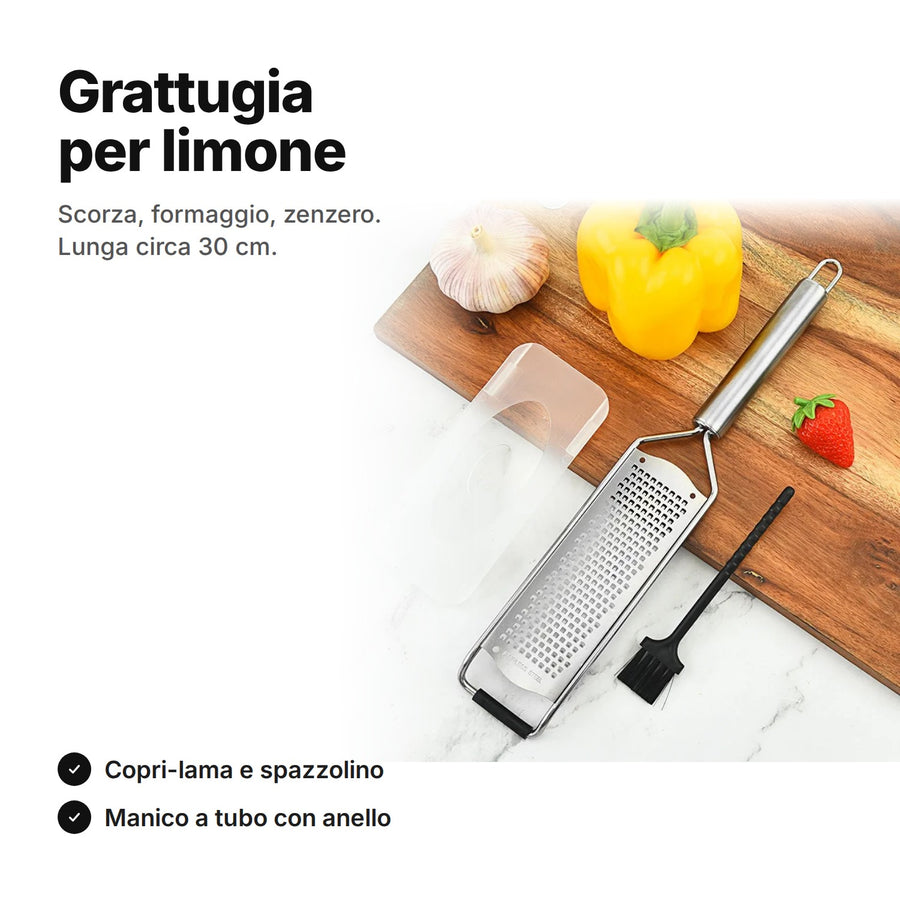 Grattugia per limone in acciaio inox con copri-lama e spazzolino su un tagliere – lunga circa 30 cm